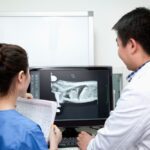 veterinary team examining pet X-ray